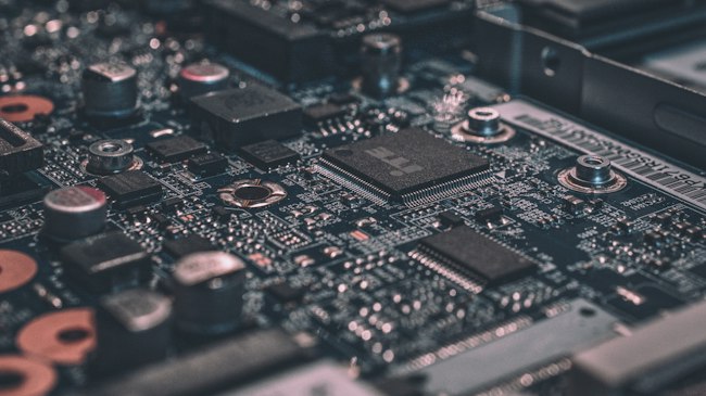 A close-up of a circuit board and AI visualization