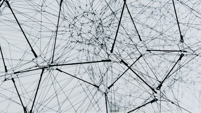 An abstract mesh of connected nodes, like a spreading network of public Wi-Fi hotspots